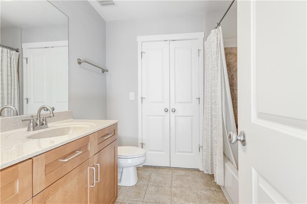 216 Semel Circle Northwest, Unit 355 Atlanta, GA 30309 - Photo 30 of 48 a bathroom with a sink a toilet and shower