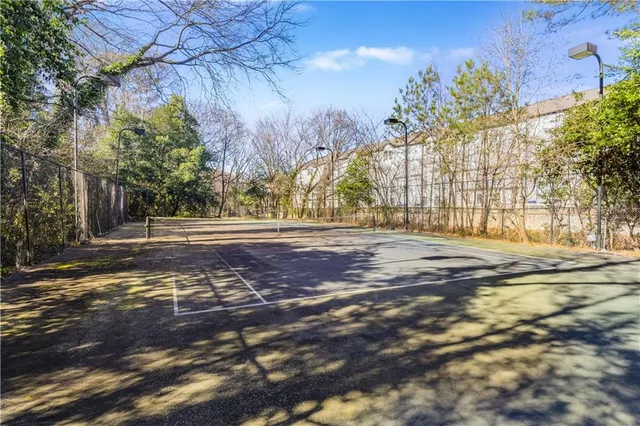 a view of a pathway with a yard