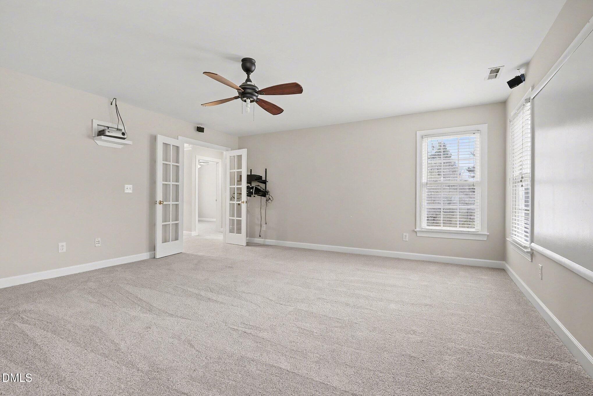 6101 Tiffield Way Wake Forest, NC 27587 - Photo 17 of 40 a view of an empty room with a window