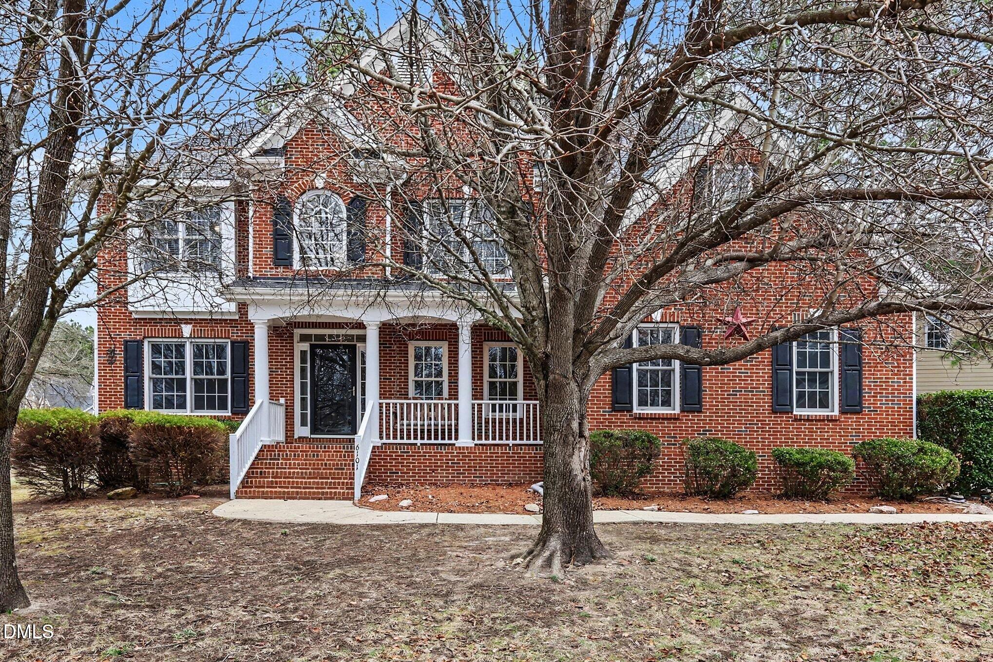 6101 Tiffield Way Wake Forest, NC 27587 - Photo 2 of 40 a front view of a house with a yard