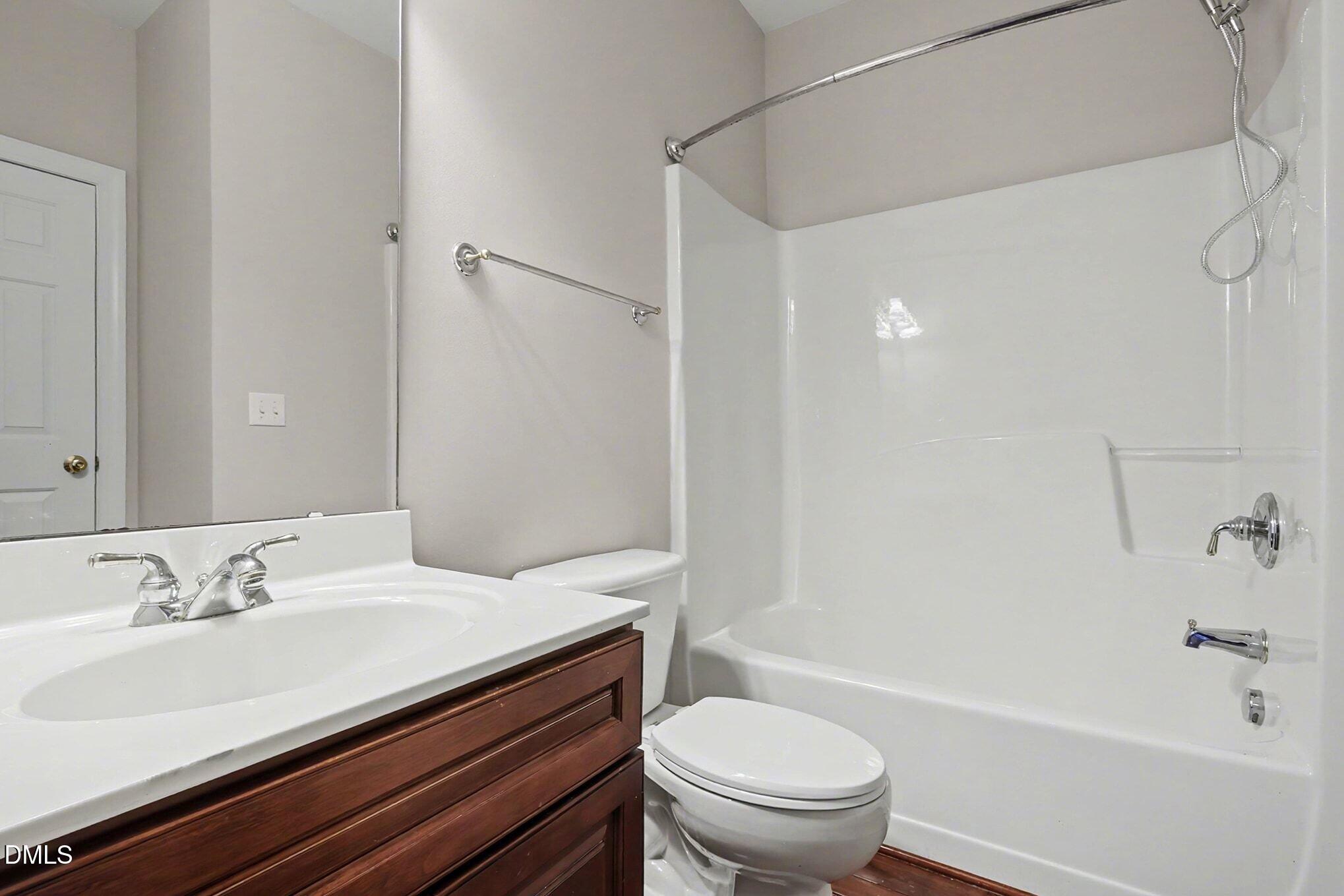 6101 Tiffield Way Wake Forest, NC 27587 - Photo 22 of 40 a bathroom with a sink a toilet and a bathtub