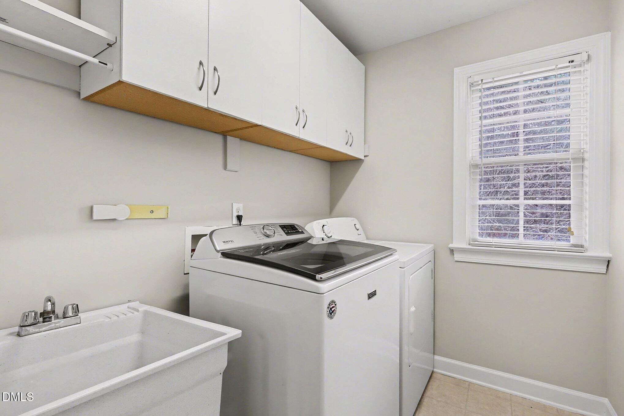 6101 Tiffield Way Wake Forest, NC 27587 - Photo 28 of 40 a utility room with dryer and washer