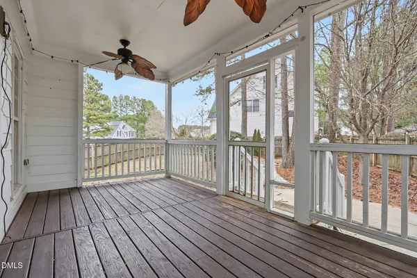 a view of porch with wooden floor