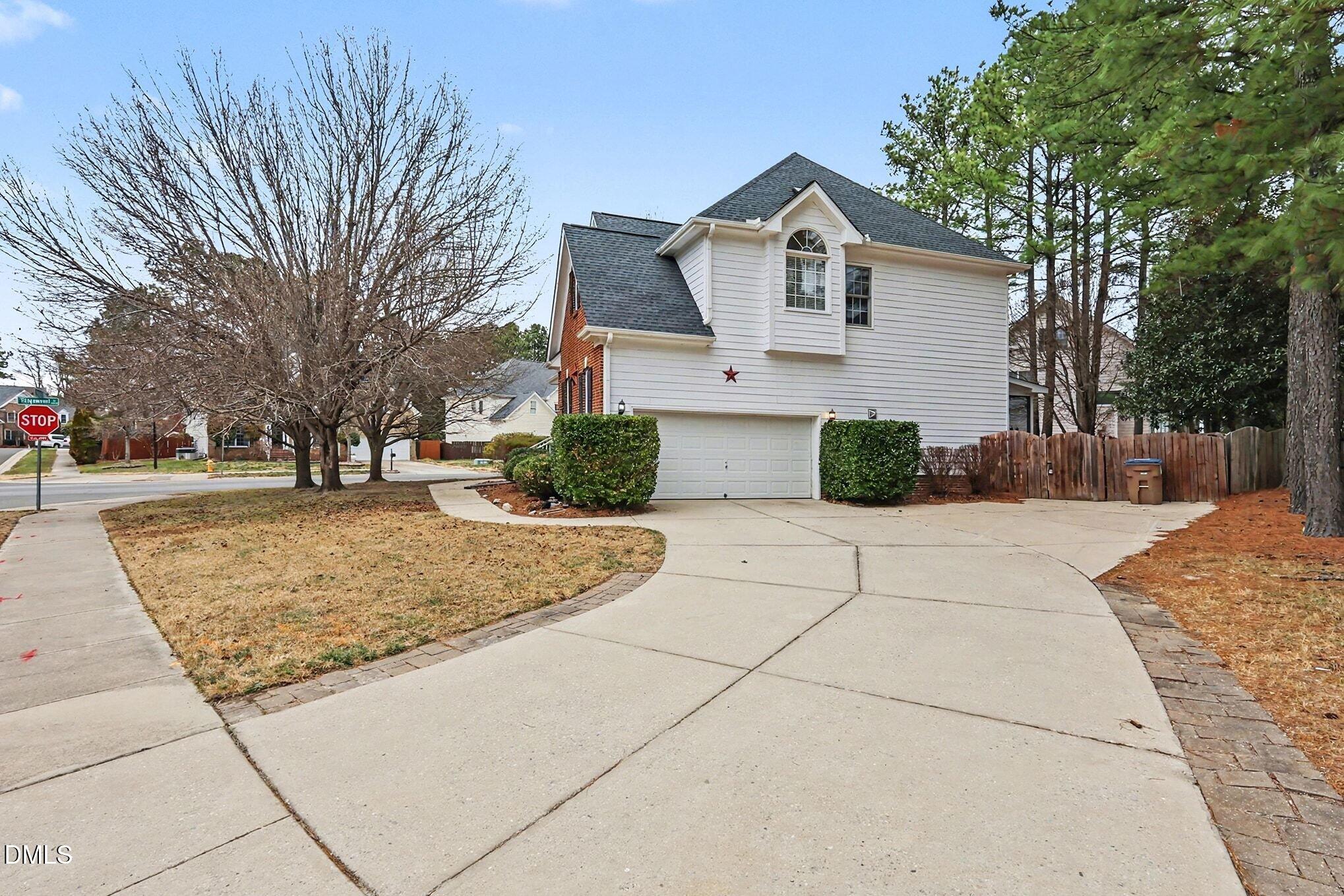 6101 Tiffield Way Wake Forest, NC 27587 - Photo 33 of 40 a front view of a house with garden