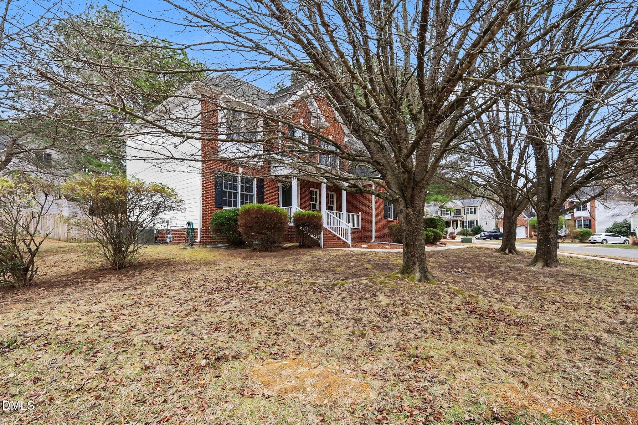 6101 Tiffield Way Wake Forest, NC 27587 - Photo 5 of 40 a tree in front of a white house