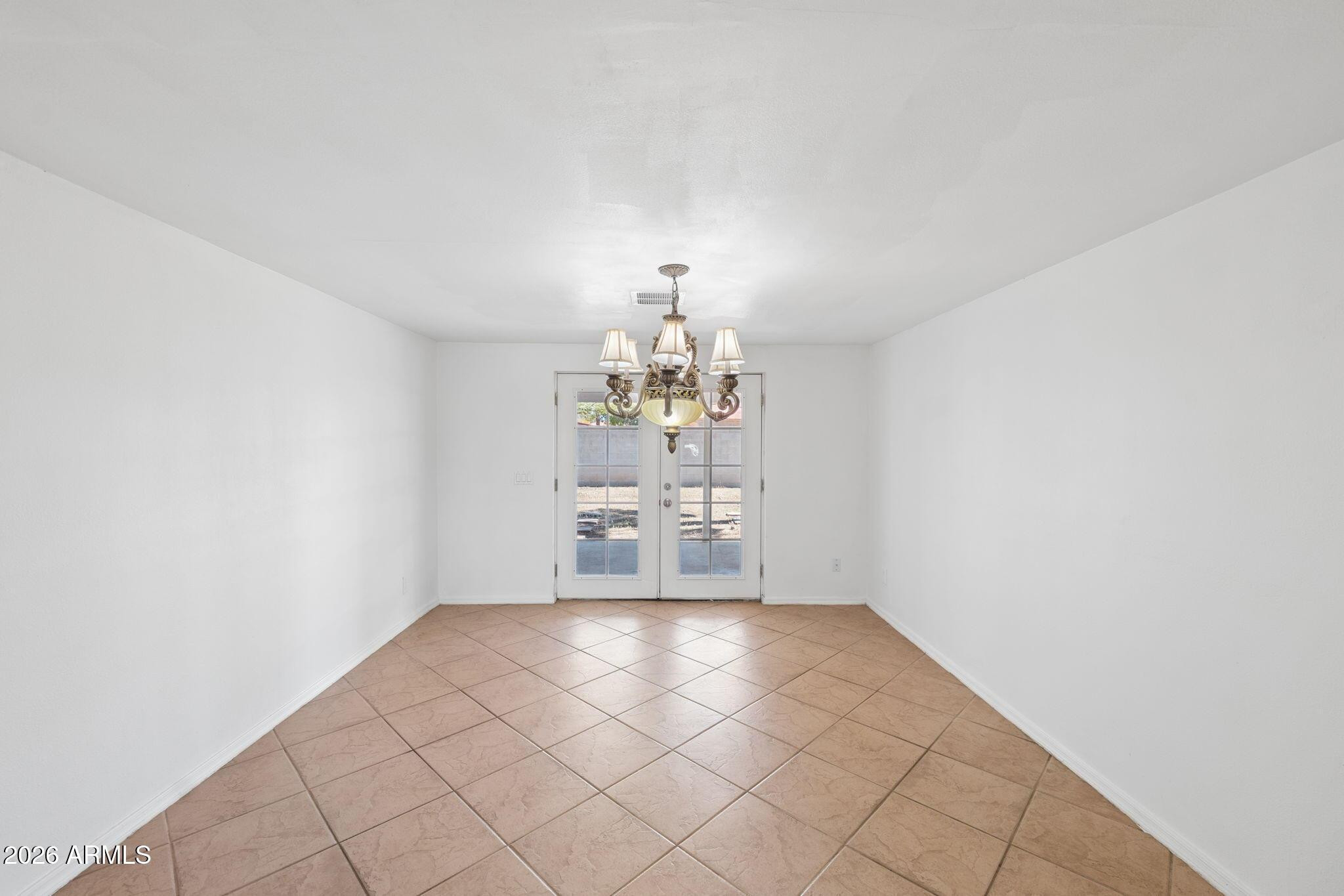 7 South Catalina Street Gilbert, AZ 85233 - Photo 10 of 34 a room with a chandelier