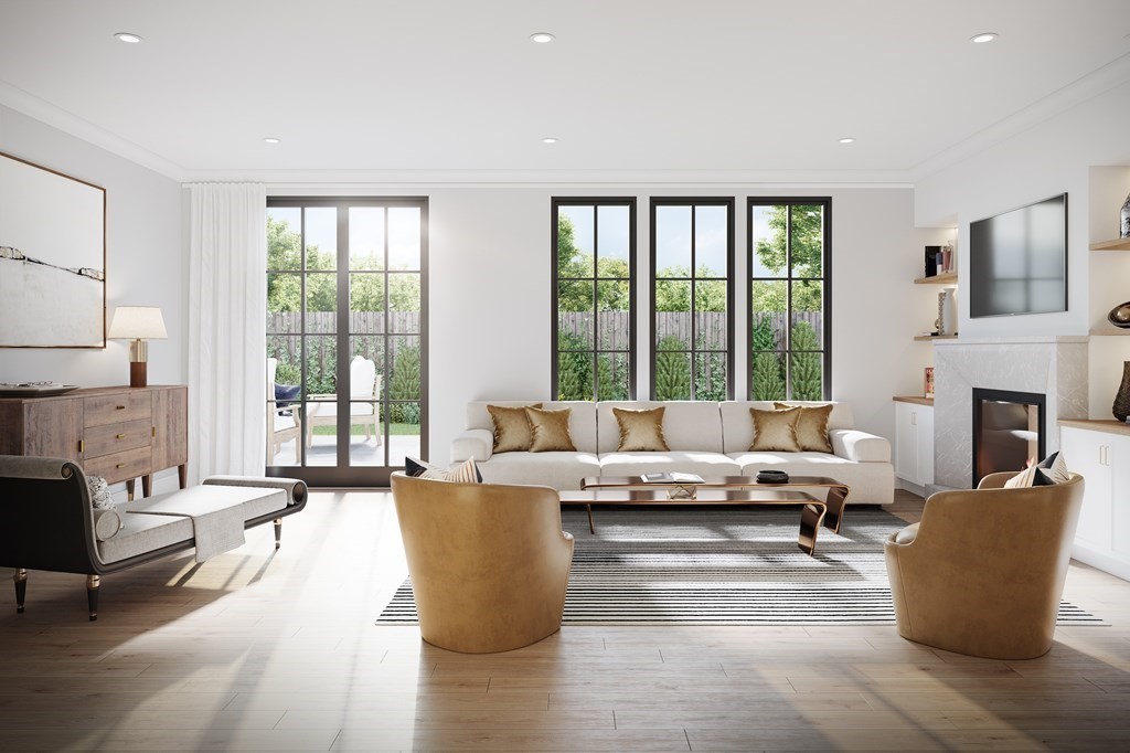 148 Weston Road, Unit 204 Wellesley, MA 02482 - Photo 5 of 11 a living room with furniture large windows and a fireplace