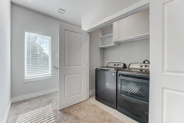 a kitchen with granite countertop stainless steel appliances a sink and cabinets