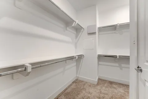 a view of an empty walk in closet