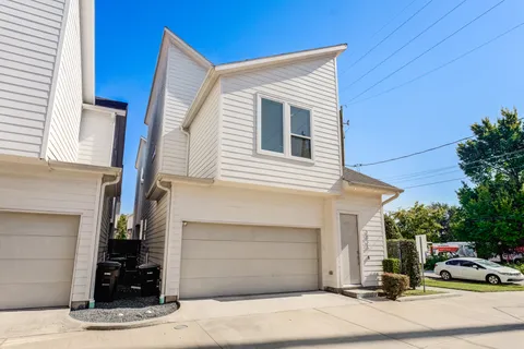 a view of a car park front of house