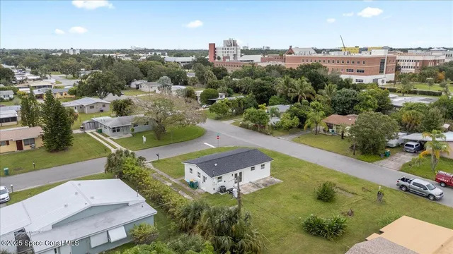 an aerial view of a house with a garden