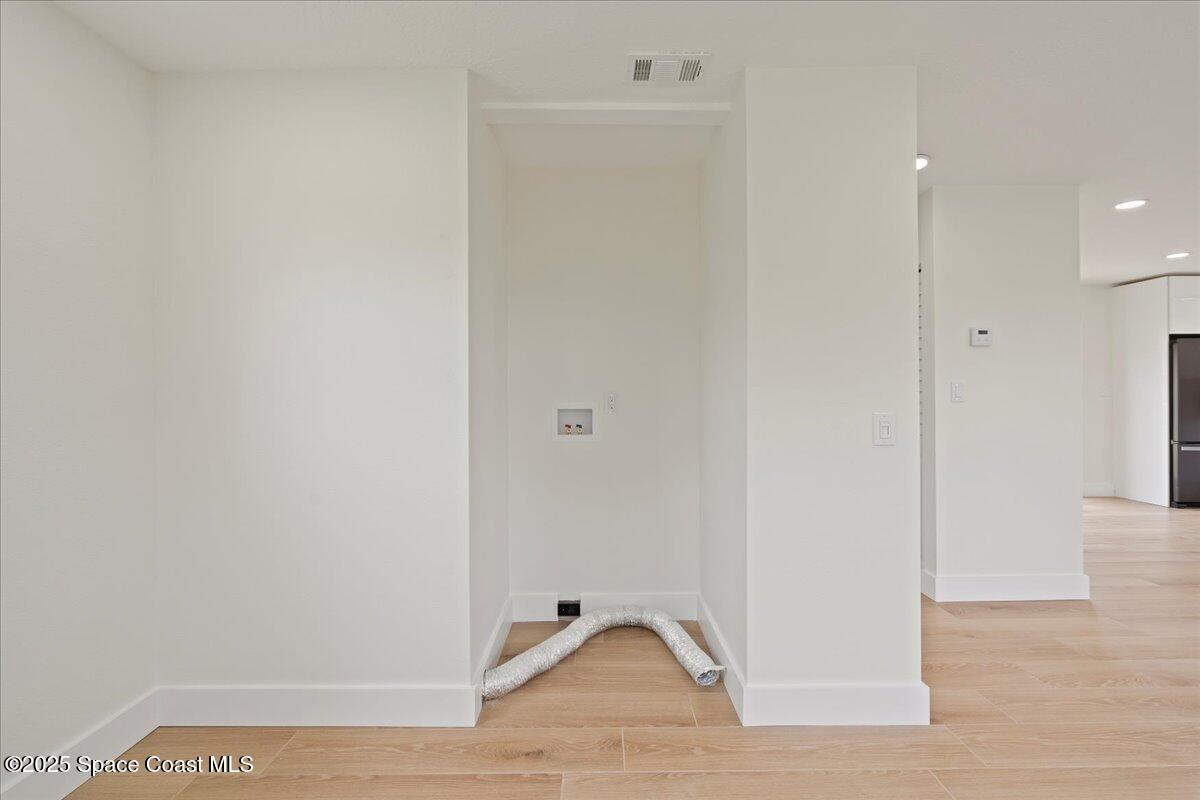 301 West Rutgers Street Melbourne, FL 32901 - Photo 12 of 36 a view of a livingroom with wooden floor