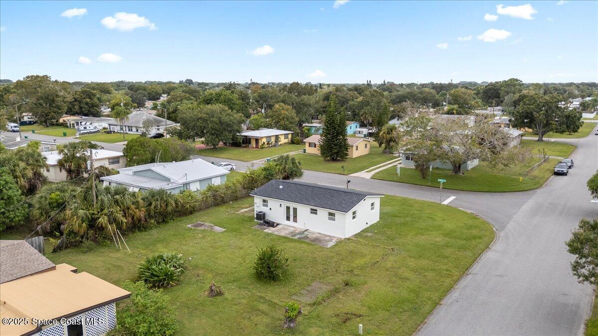 301 West Rutgers Street Melbourne, FL 32901 - Photo 29 of 36 a view of a house with a yard and lake view