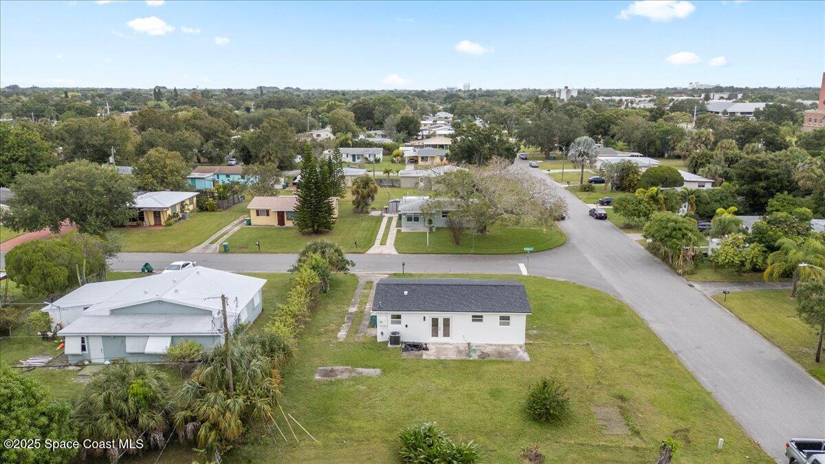 301 West Rutgers Street Melbourne, FL 32901 - Photo 30 of 36 an aerial view of residential houses with outdoor space and trees