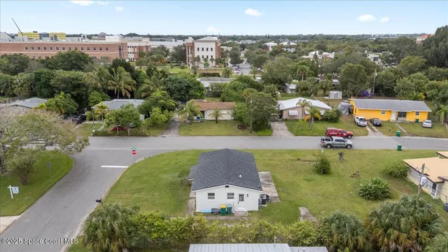 an aerial view of a house with a garden
