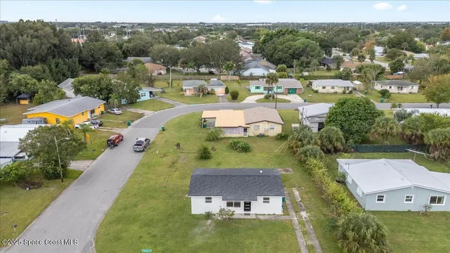an aerial view of a house with a garden