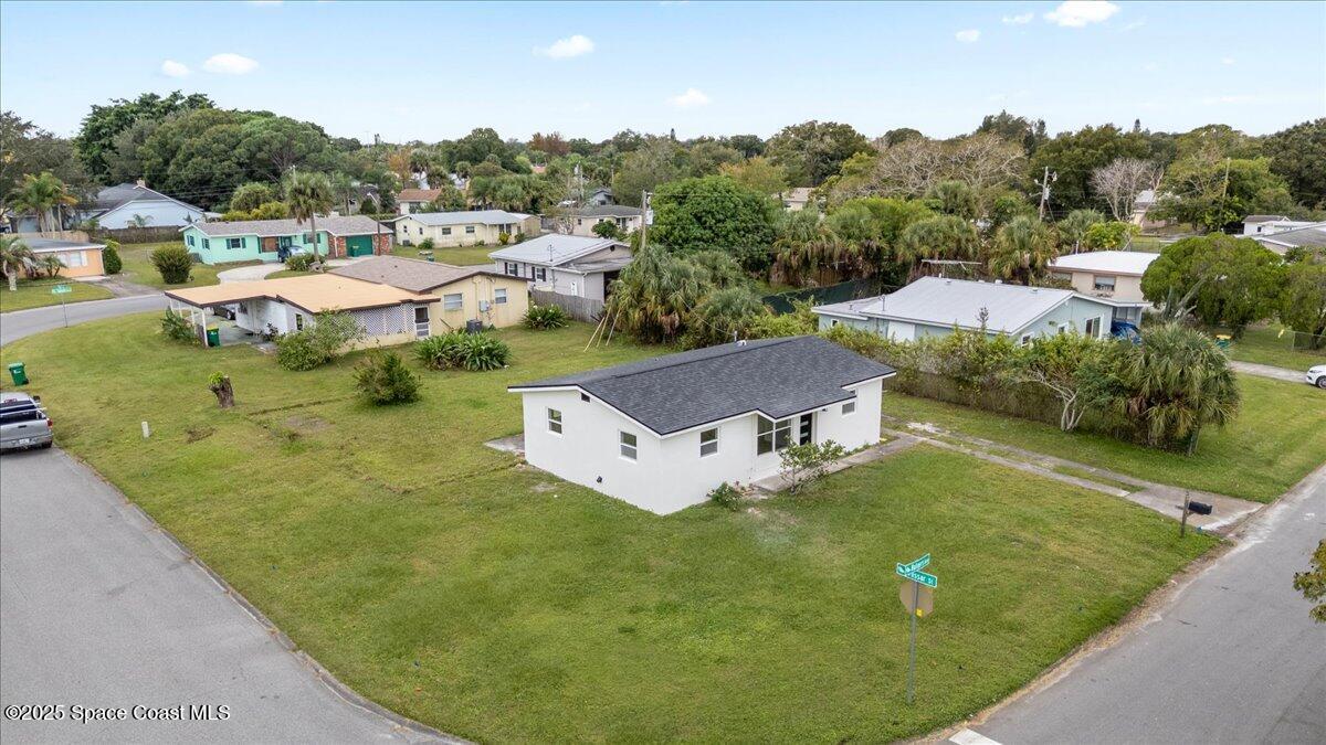 301 West Rutgers Street Melbourne, FL 32901 - Photo 36 of 36 a view of a house with pool and a yard