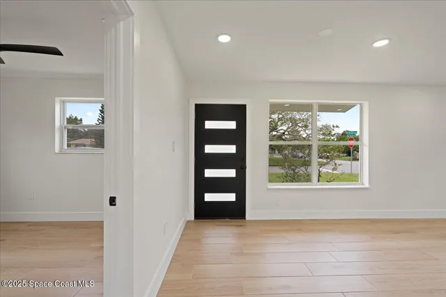 a view of an empty room with a window