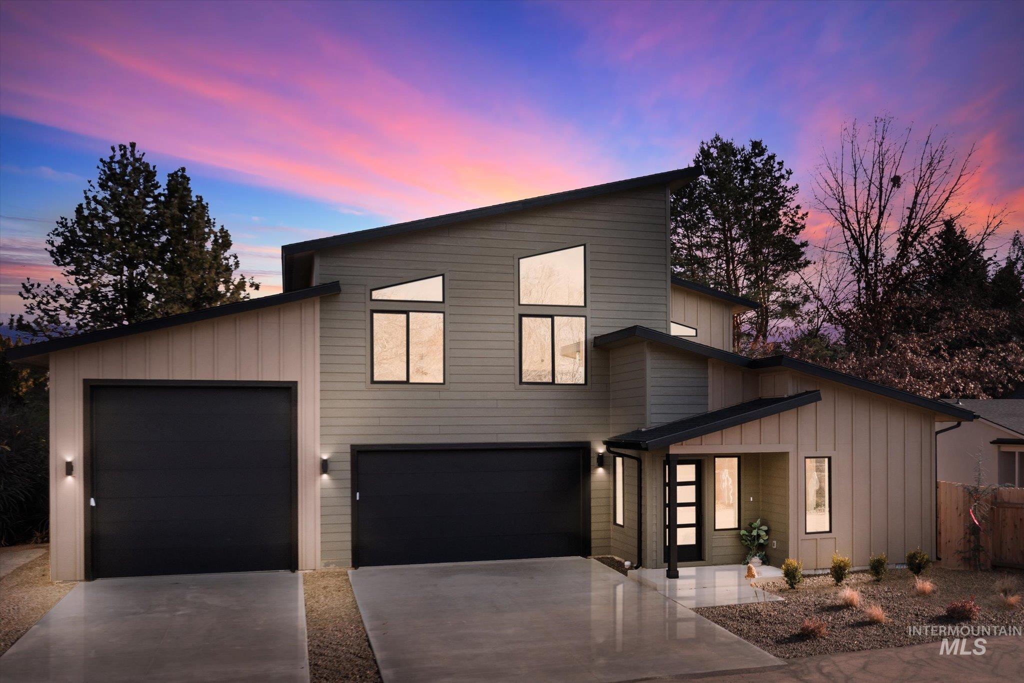 5612 West Grover Street Boise, ID 83705 - Photo 1 of 50 Modern home with board and batten siding and concrete driveway