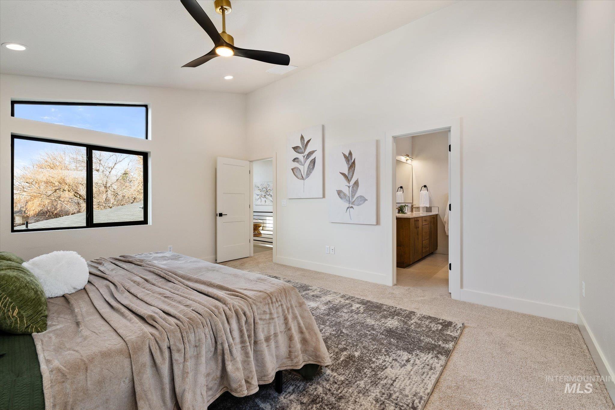 5612 West Grover Street Boise, ID 83705 - Photo 25 of 50 Bedroom with light carpet, a ceiling fan, ensuite bath, recessed lighting, and high vaulted ceiling
