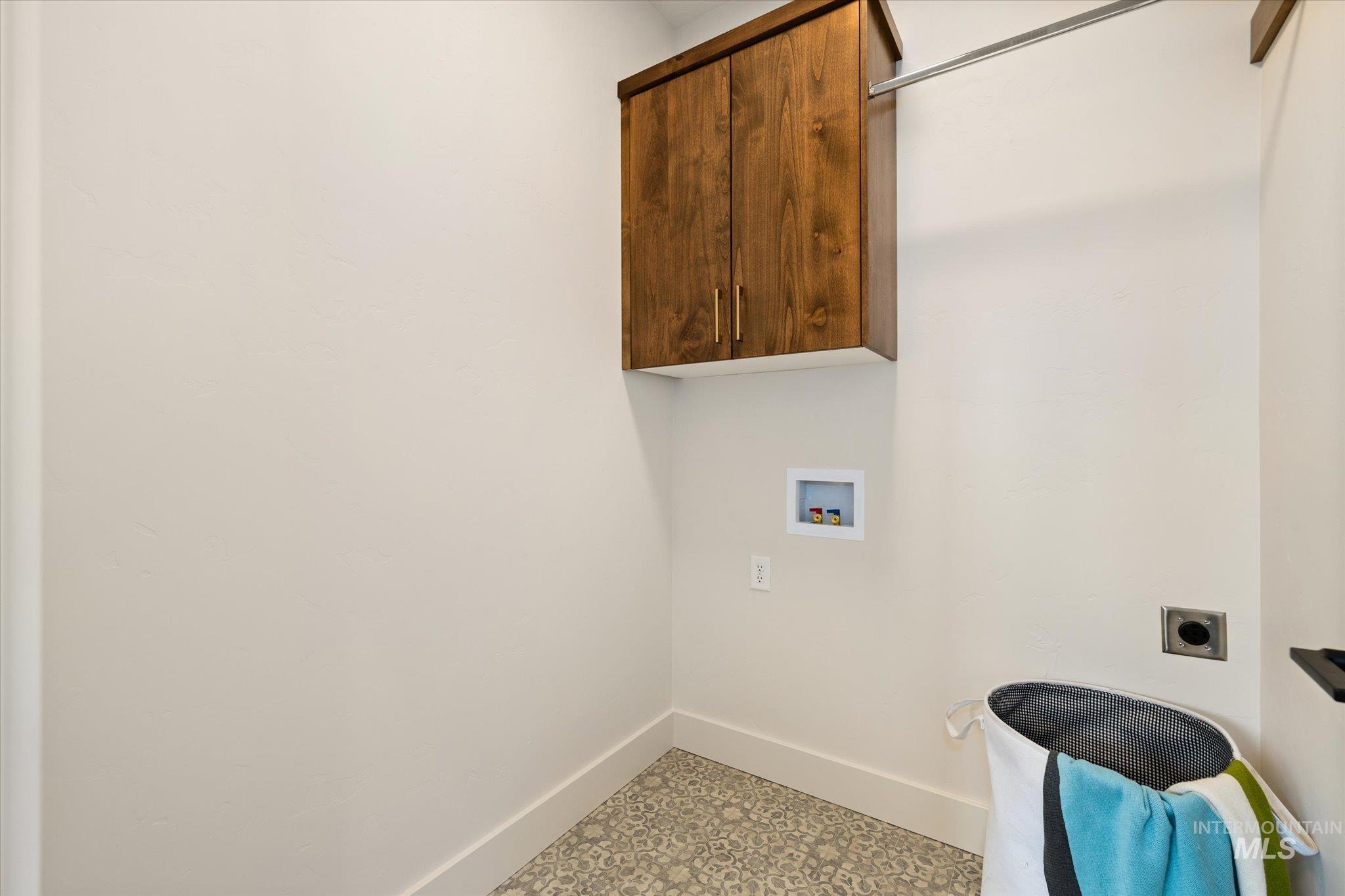 5612 West Grover Street Boise, ID 83705 - Photo 41 of 50 Washroom featuring cabinet space, hookup for a washing machine, and hookup for an electric dryer