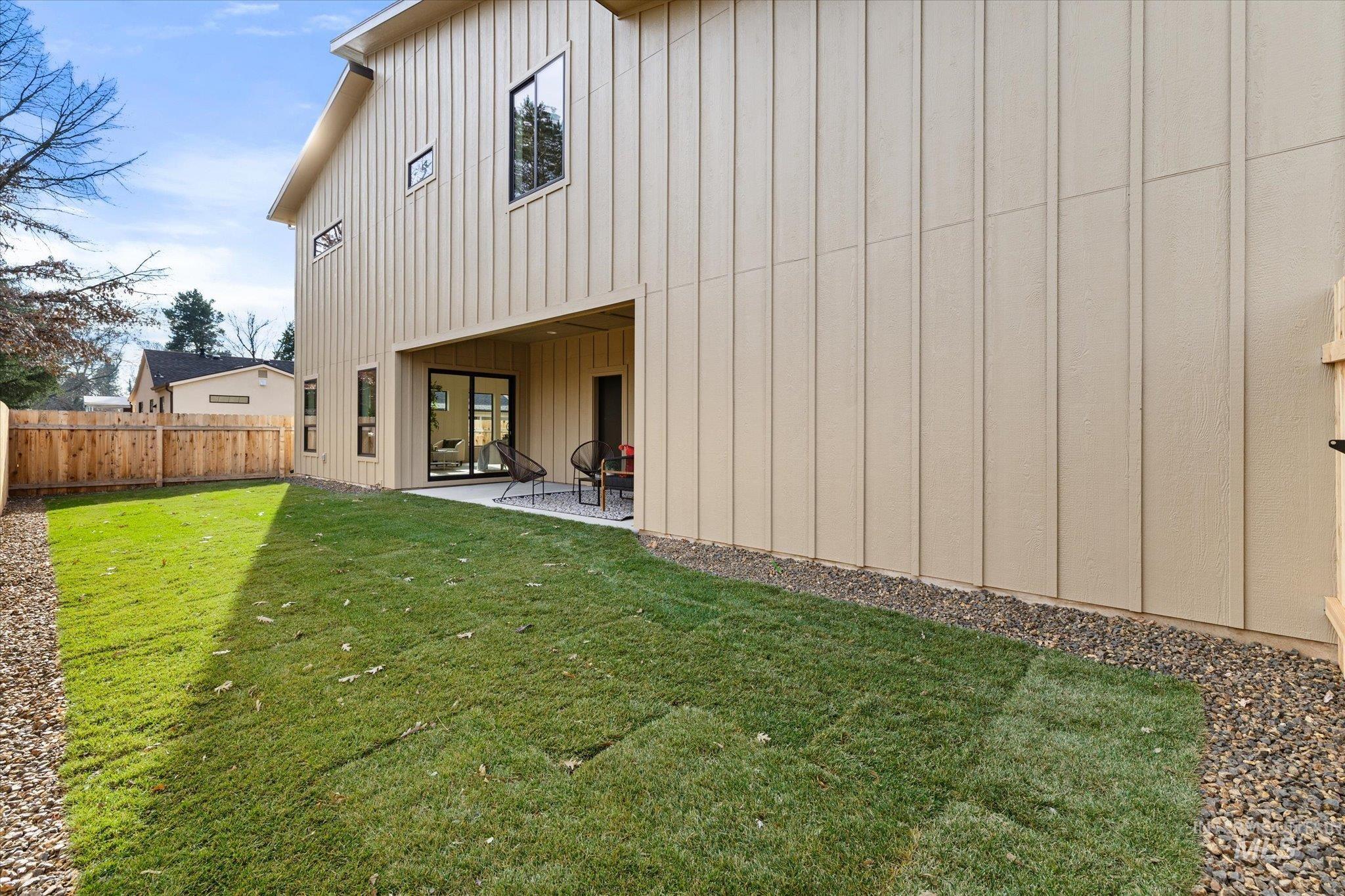 5612 West Grover Street Boise, ID 83705 - Photo 45 of 50 Back of house featuring board and batten siding and a patio area