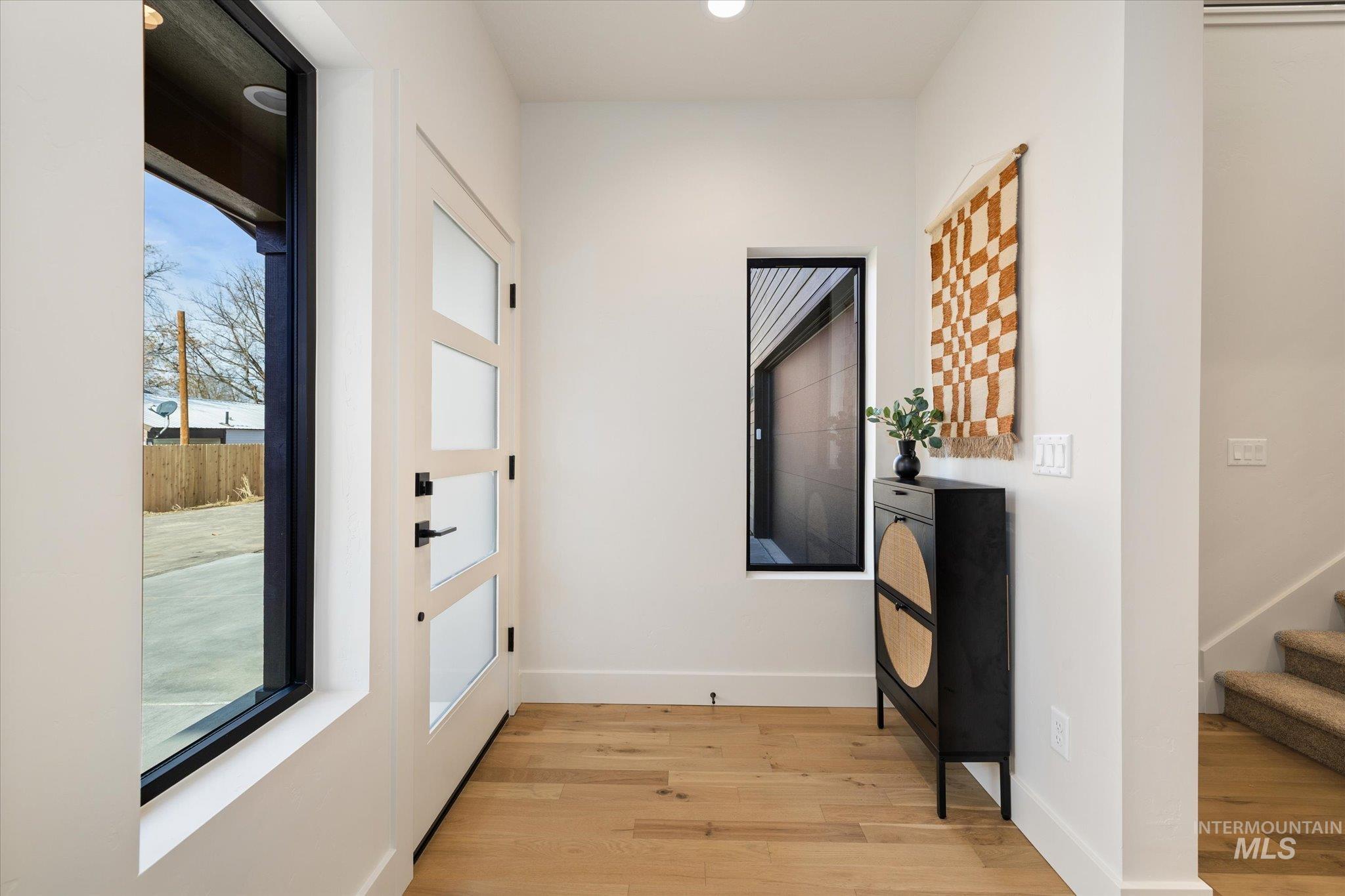 5612 West Grover Street Boise, ID 83705 - Photo 6 of 50 Corridor with light wood-style flooring, stairs, and recessed lighting