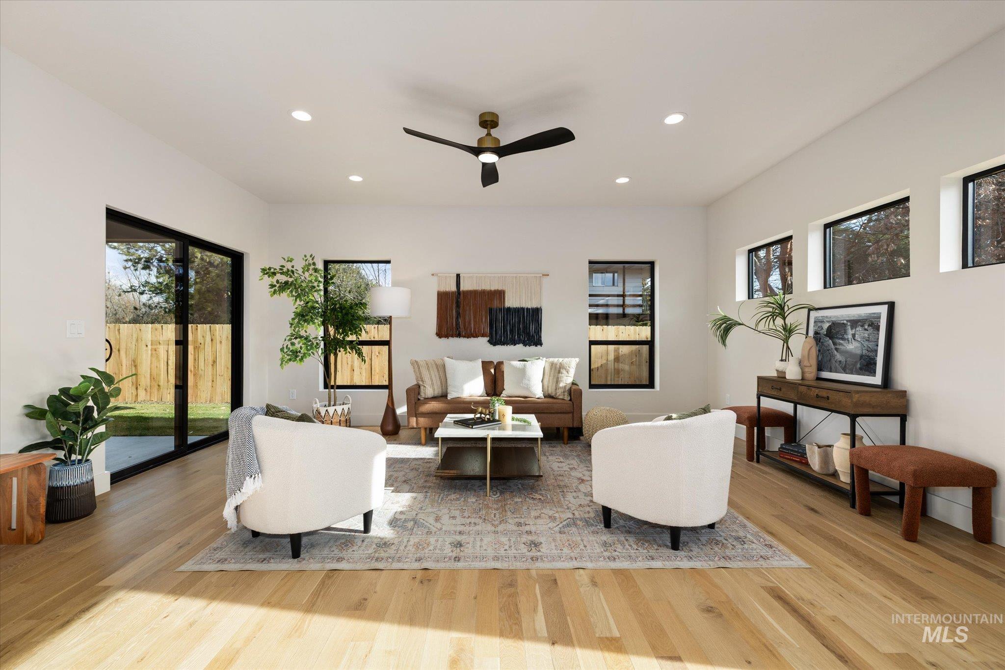 5612 West Grover Street Boise, ID 83705 - Photo 8 of 50 Living area featuring a ceiling fan, recessed lighting, light wood-type flooring, and plenty of natural light
