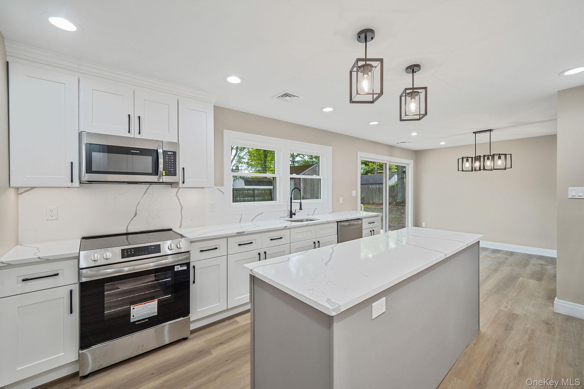 41 Winside Lane Coram, NY 11727 - Photo 12 of 33 Designer kitchen with stainless steel appliances