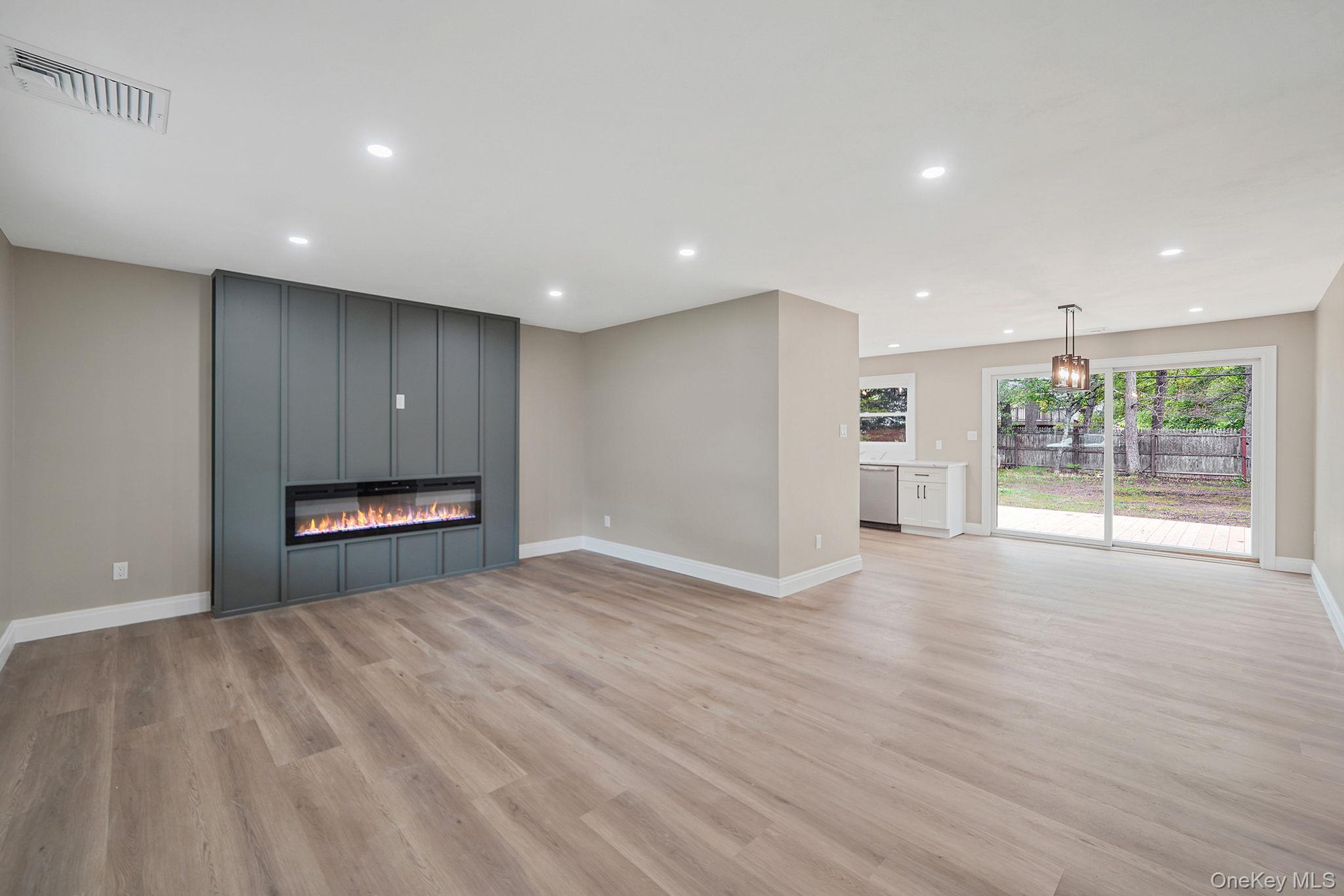 41 Winside Lane Coram, NY 11727 - Photo 2 of 33 With sleek electric fireplace