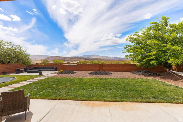 225 Falcon Court Ivins, UT 84738 - Photo 29 of 47 Fenced backyard with a mountain view and a patio area