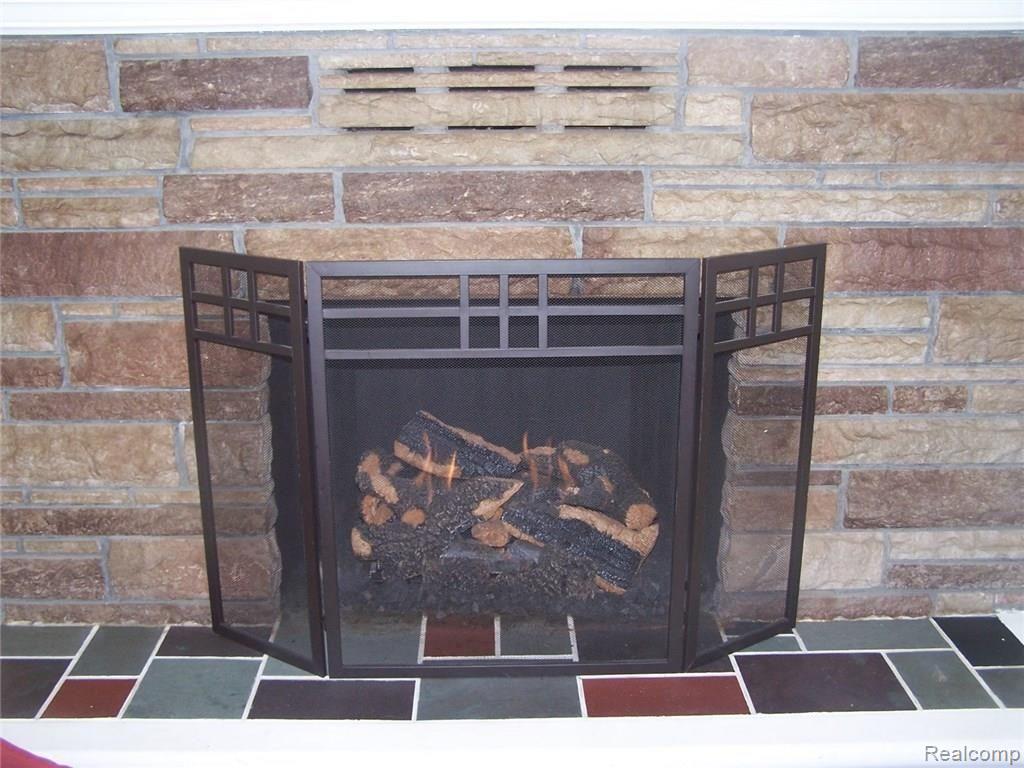 23220 Hagen Road Macomb, MI 48042 - Photo 36 of 58 STONE FIREPLACE