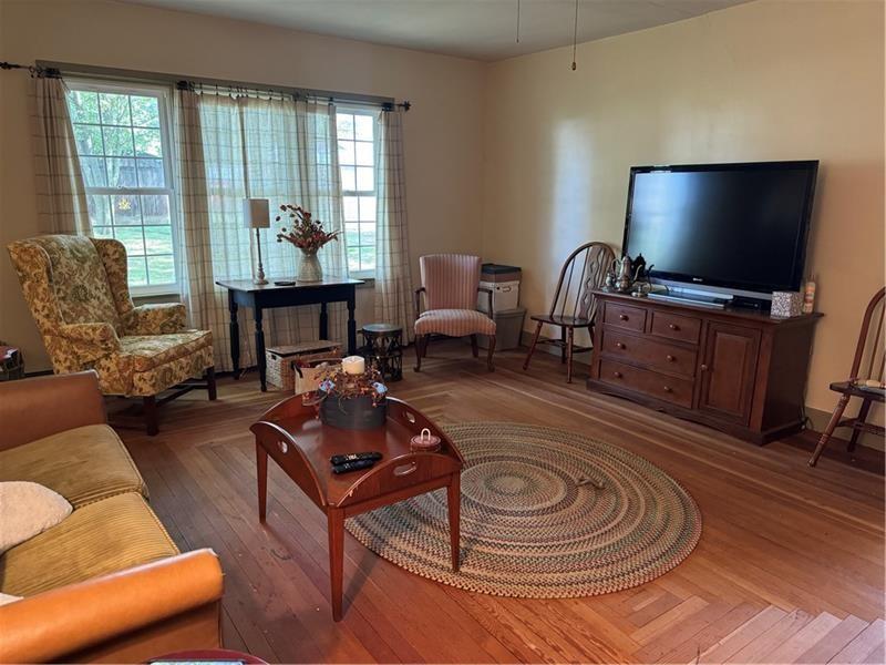 149 South Franklin Street Prospect, PA 16052 - Photo 8 of 25 a living room with furniture and a flat screen tv