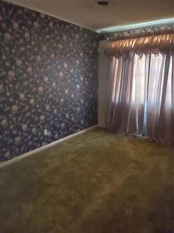 a bathroom with a granite countertop sink a mirror and shower