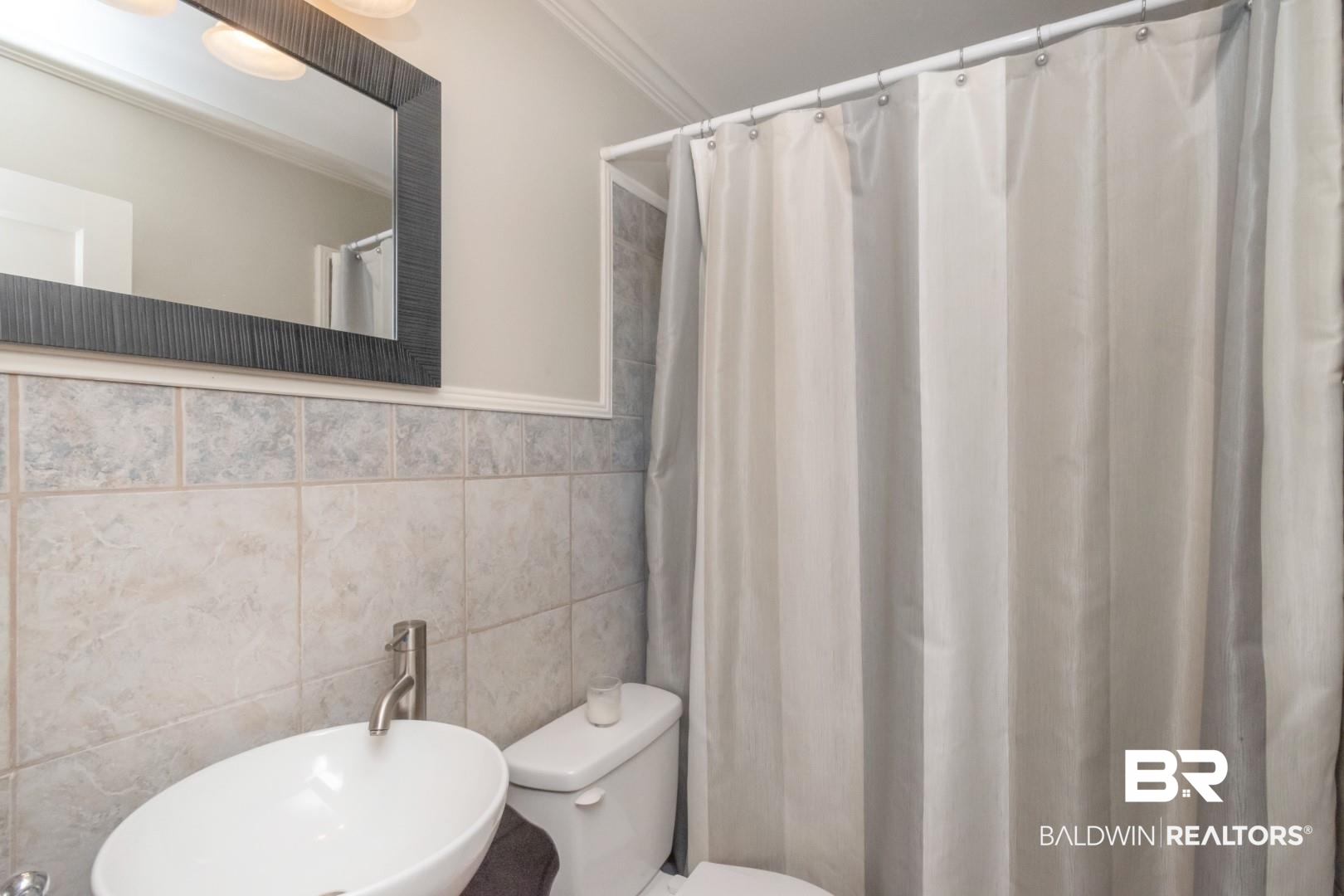 116 Florence Place Mobile, AL 36607 - Photo 28 of 41 Bathroom with tile walls, crown molding, and toilet