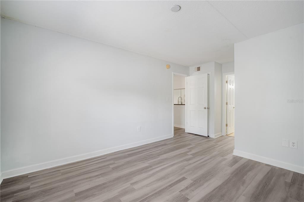 5305 San Sebastian Court, Unit 125 Tampa, FL 33609 - Photo 12 of 21 a view of an empty room and wooden floor