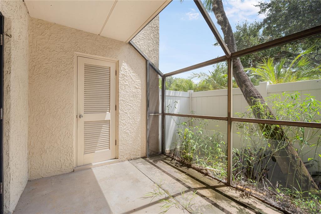 5305 San Sebastian Court, Unit 125 Tampa, FL 33609 - Photo 16 of 21 a view of a balcony with a floor to ceiling window and wooden floor