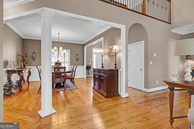a view of a dining room with furniture window and wooden floor