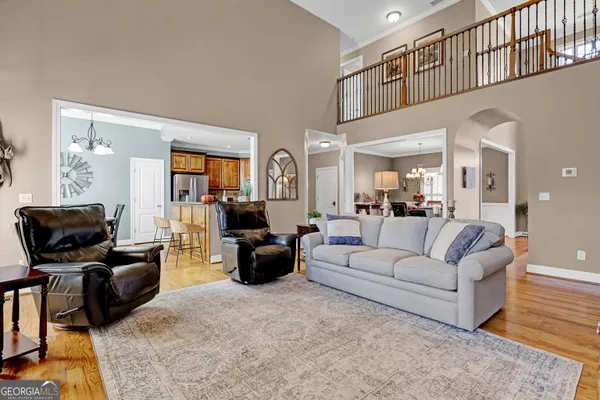 a spacious bathroom with a sink and a mirror