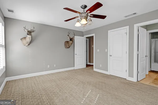 a bathroom with a granite countertop sink mirror and vanity