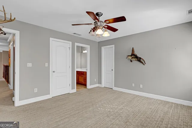a bathroom with a sink vanity granite and toilet