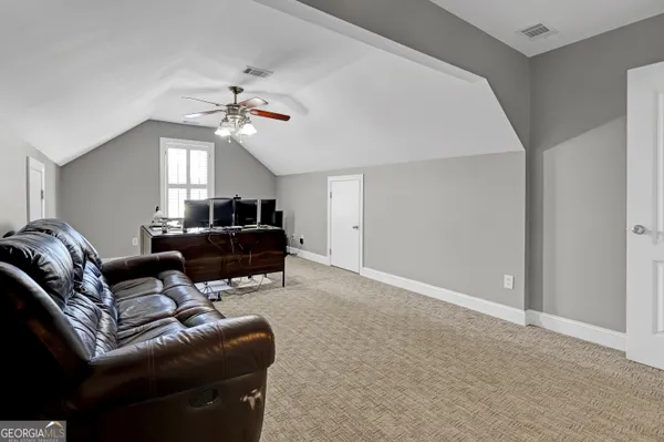 a view of a car park in front of house