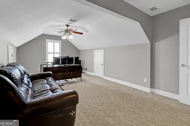 a view of a car park in front of house