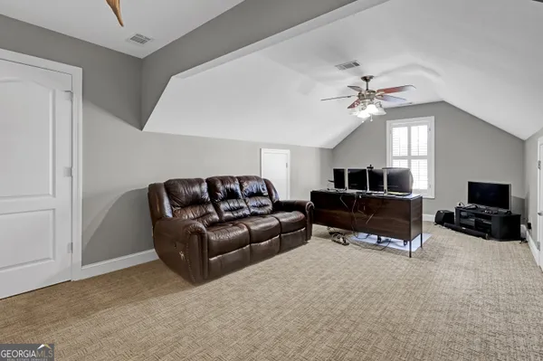 a view of a patio with table and chairs with wooden floor and fence