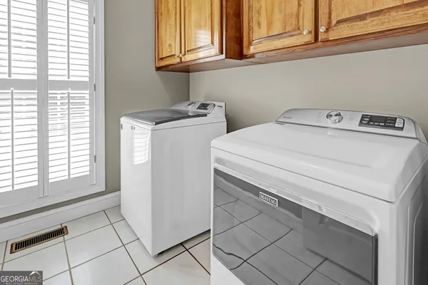 a view of balcony with wooden floor and outdoor seating