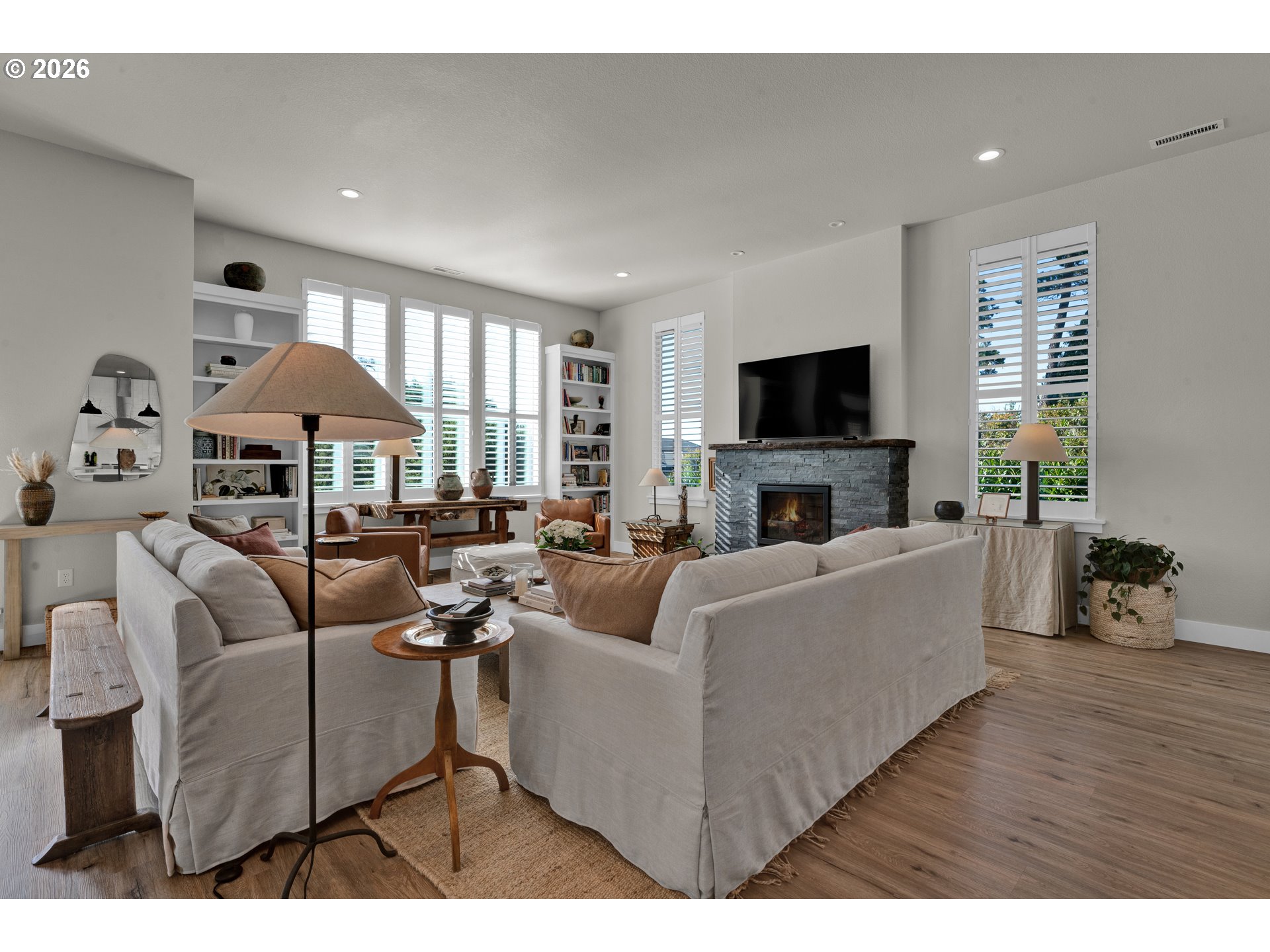 34 Bonnett Way Florence, OR 97439 - Photo 18 of 48 a living room with furniture a fireplace and a flat screen tv