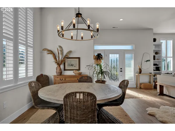 a view of a dining room with furniture and window