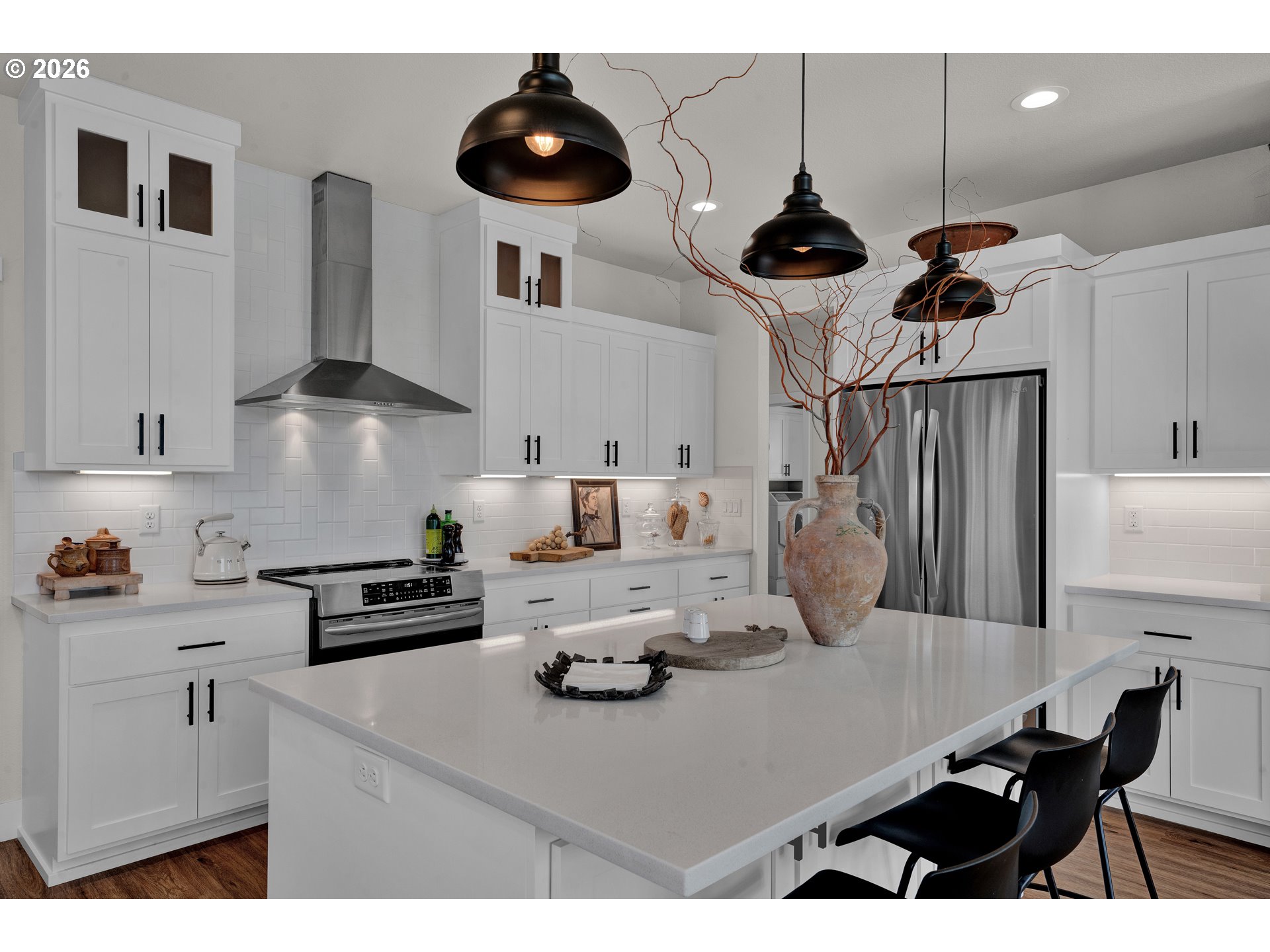 34 Bonnett Way Florence, OR 97439 - Photo 22 of 48 a kitchen with stainless steel appliances a table chairs and a refrigerator