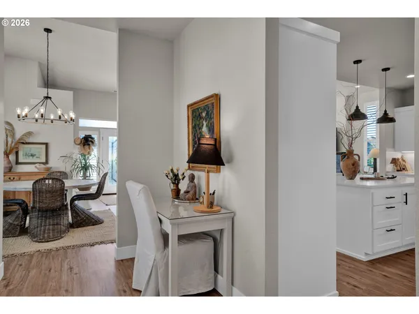 a dining room with furniture and chandelier