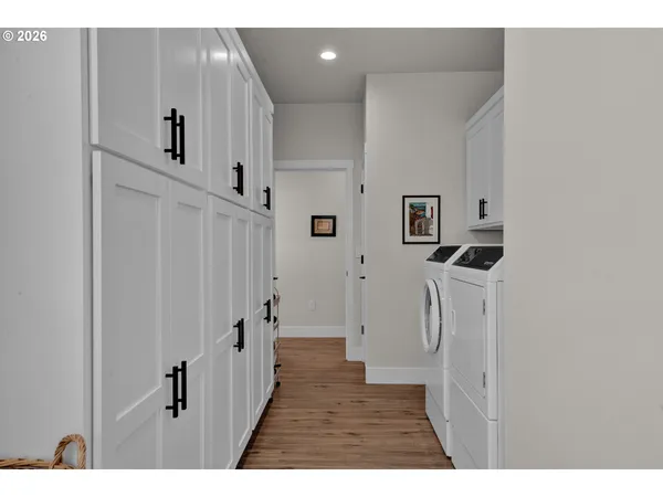 a view of a hallway with white doors